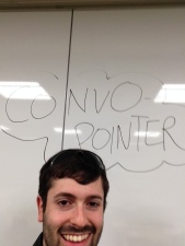 Zack standing under the (glary) Convopointer whiteboard sign, so that people could find him! 